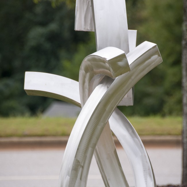 A metal sculpture with lines and curves