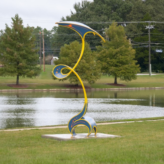 An outdoor sculpture with painted curves
