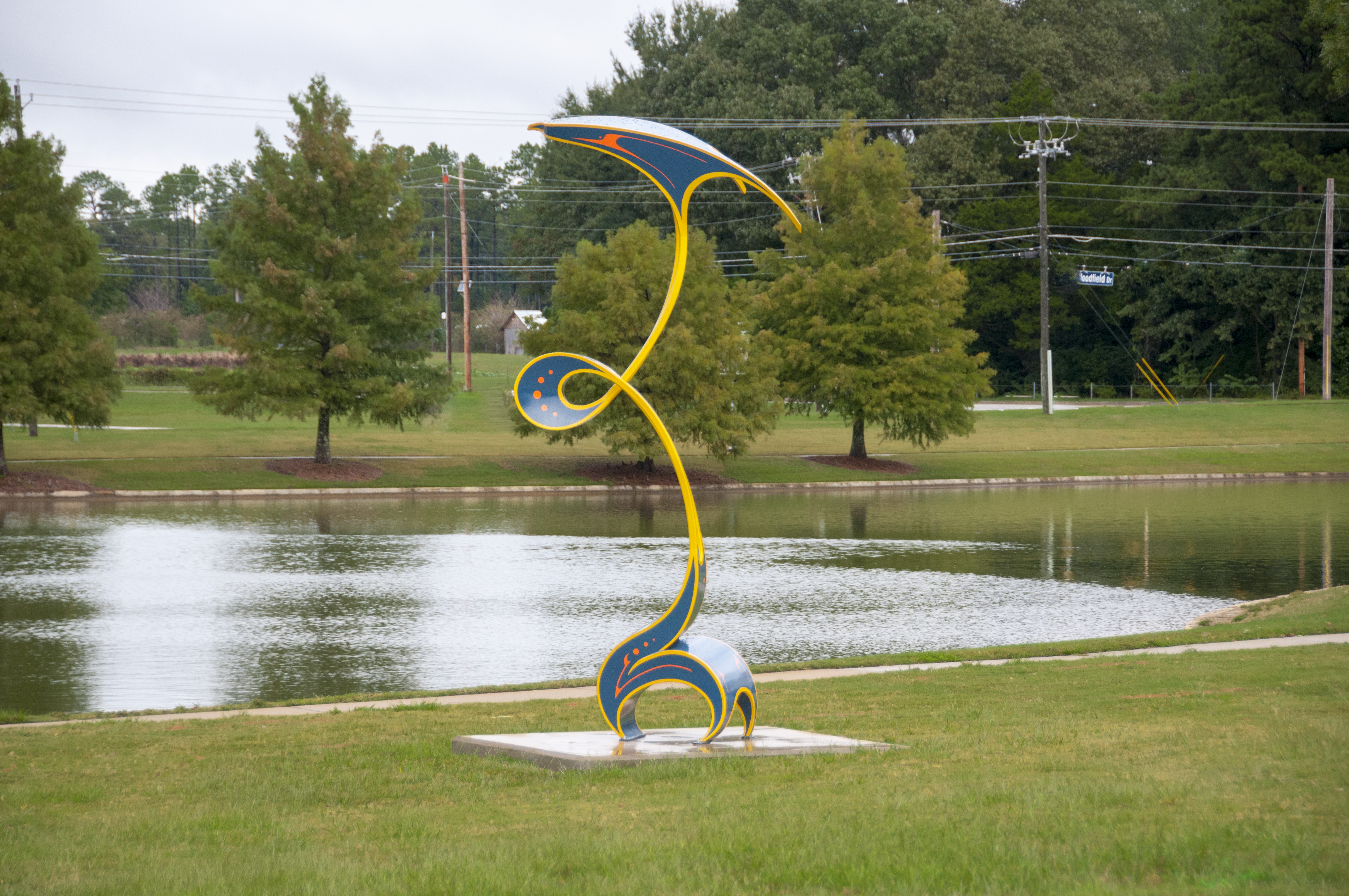 An outdoor sculpture with painted curves