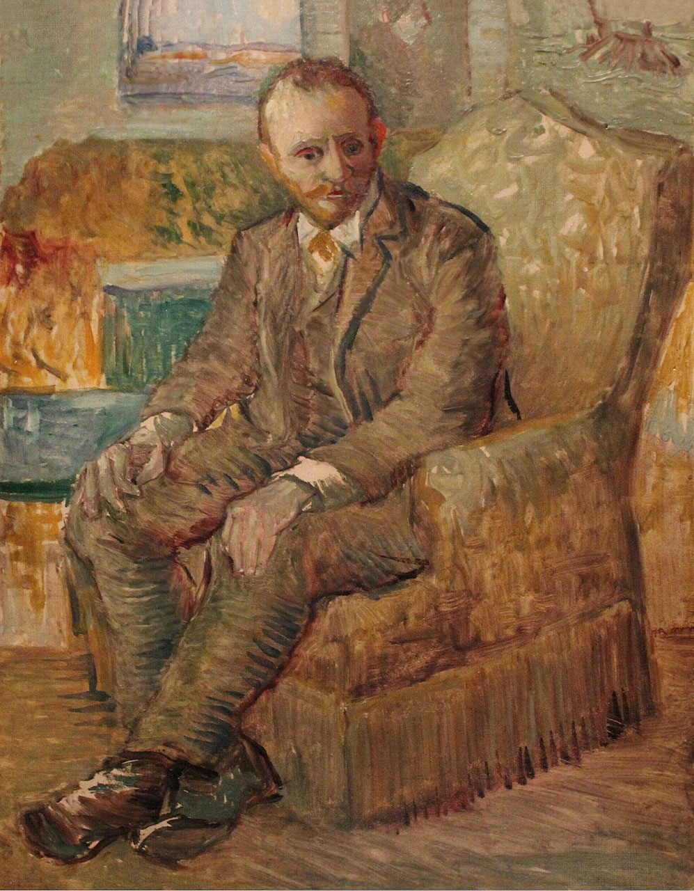 Portrait of art dealer Alexander-Reid sitting in an easy chair