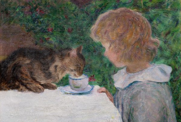 A small cat drinks out of a girl's teacup.