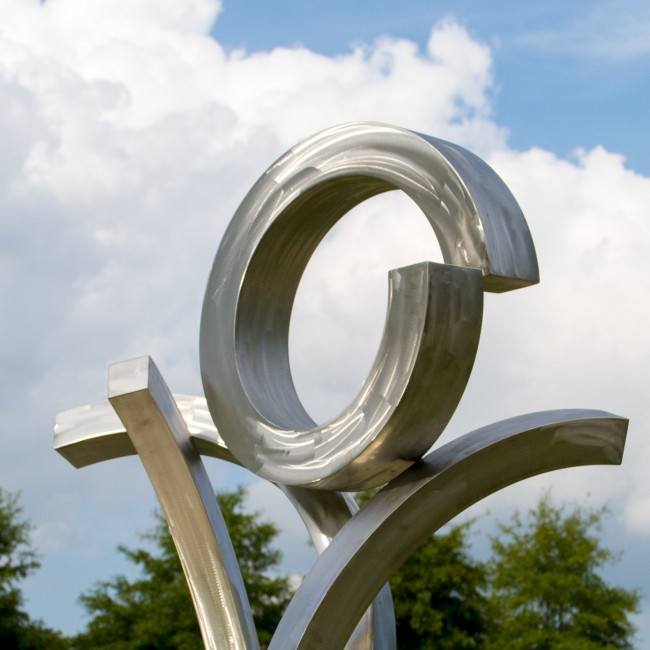 A metal sculpture with lines and curves