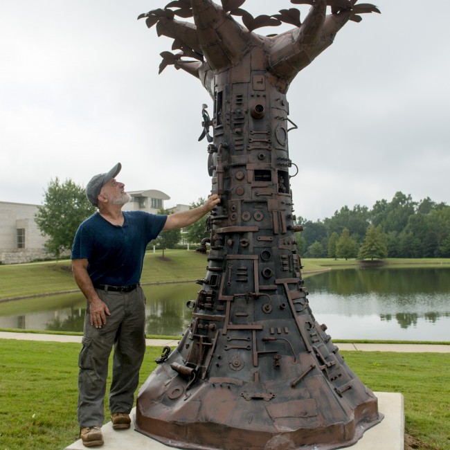 Artist Charles Pilkey shown here with Tree of Good and Evil.