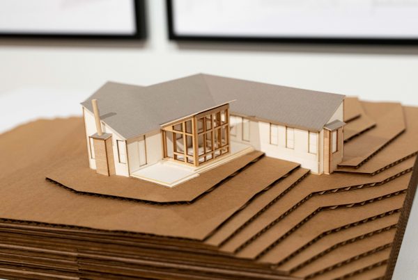 A cardboard model of a designed home.