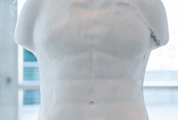 A marble sculpture of a man's torso.