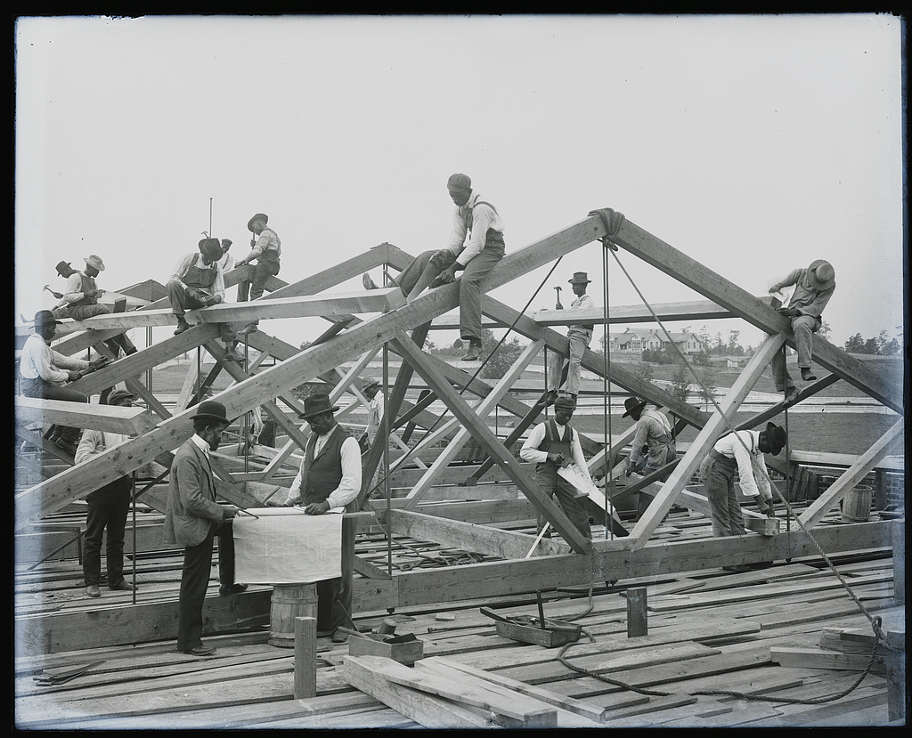 Archival photograph of roof construction by students at Tuskegee Institute