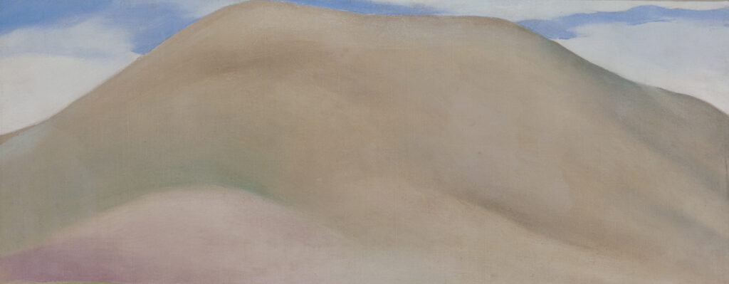 An elongated image of a hill done in pinkish mauve and green with a blue sky and white clounds above