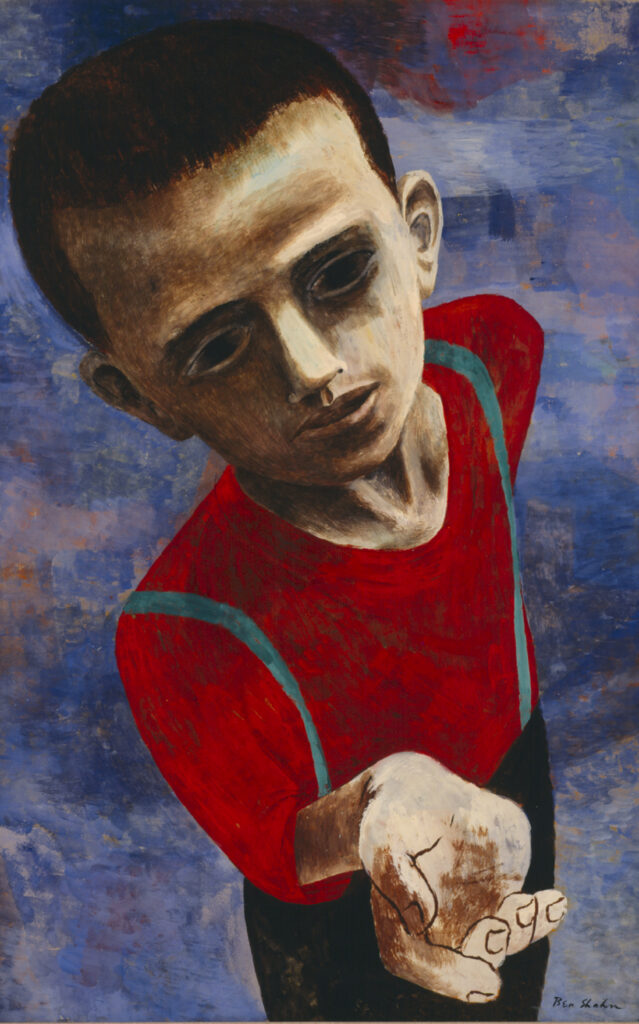 A foreshortened view from above of boy with shaved hair and dark, sunken eyes in a red shirt, black pants, and blue suspenders on a blue background with his hand outstretched
