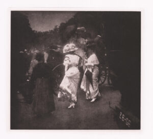 Black-and-white image of two women in white Victorian-era dresses getting out of a carriage.