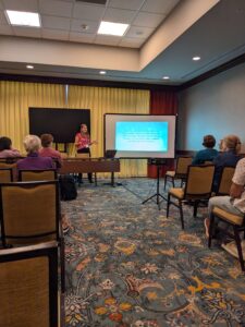 Eleanor Hickman, a student guide at The Jule, presents to SEMC conference attendees.