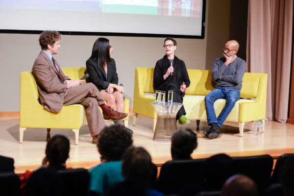 Forum moderator and Auburn University professor Elijah Gaddis (left) with speakers Es-pranza Humphrey of Poster House (center left), Leslie Umberger of the Smithsonian American Art Museum (center right) and Darby English of the University of Chicago (right). Gaddis wears a brown tweed suit, Humphrey wears a black blazer with shoulder-length hair and black framed glasses, Umberger has cropped hair with a black blazer, and English wears jeans and a grey sweater.