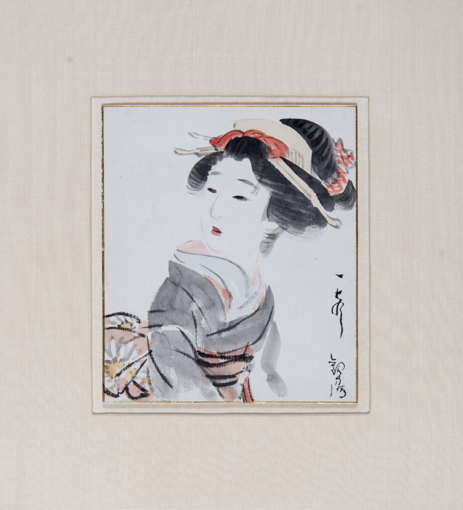 Three-quarter image of a woman turning her head back over her shoulder. Japanese writing on lower right edge. Gold painted edge.
